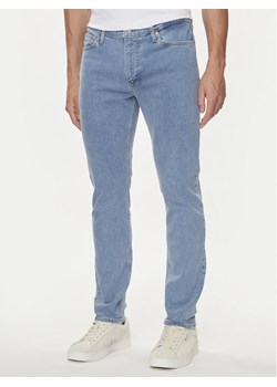 Tommy Jeans Jeansy Simon DM0DM18771 Niebieski Skinny Fit ze sklepu MODIVO w kategorii Jeansy męskie - zdjęcie 182679342