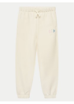 Gap Spodnie dresowe 709023-00 Beżowy Regular Fit ze sklepu MODIVO w kategorii Spodnie dziewczęce - zdjęcie 182681053