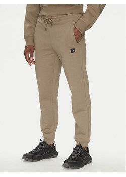 HUGO Spodnie dresowe Dimacs 50533695 Brązowy Relaxed Fit ze sklepu MODIVO w kategorii Spodnie męskie - zdjęcie 182681420