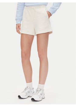 Tommy Jeans Szorty sportowe Tjw Script Short Ext DW0DW20353 Beżowy Regular Fit ze sklepu MODIVO w kategorii Szorty - zdjęcie 182684774