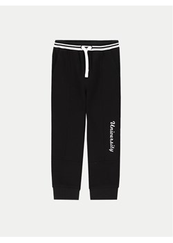 Coccodrillo Spodnie dresowe ZC4120201ABK Czarny Regular Fit ze sklepu MODIVO w kategorii Spodnie chłopięce - zdjęcie 182685403