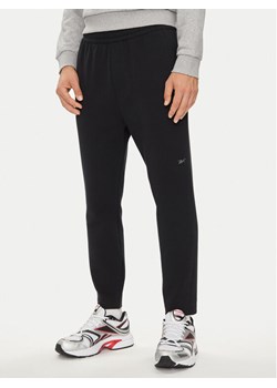Reebok Spodnie dresowe Actic Coll Dreamblend 100075686 Czarny Regular Fit ze sklepu MODIVO w kategorii Spodnie męskie - zdjęcie 182685854