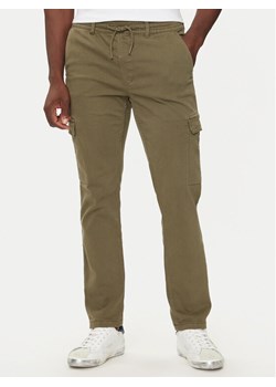 Pepe Jeans Spodnie materiałowe PM211725 Zielony Slim Fit ze sklepu MODIVO w kategorii Spodnie męskie - zdjęcie 182686902
