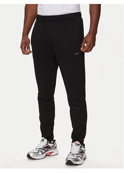 Reebok Spodnie dresowe 100070726 Czarny Regular Fit ze sklepu MODIVO w kategorii Spodnie męskie - zdjęcie 182687914