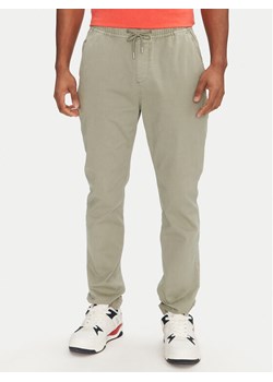 Tommy Jeans Joggery Austin DM0DM20283 Zielony Slim Fit ze sklepu MODIVO w kategorii Spodnie męskie - zdjęcie 182688313