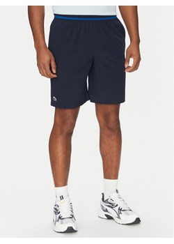 Lacoste Szorty sportowe GH7413 Granatowy Regular Fit ze sklepu MODIVO w kategorii Spodenki męskie - zdjęcie 182688501