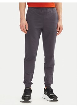 EA7 Emporio Armani Spodnie dresowe 8NPP66 PJVRZ U8115 Szary Slim Fit ze sklepu MODIVO w kategorii Spodnie męskie - zdjęcie 182691550