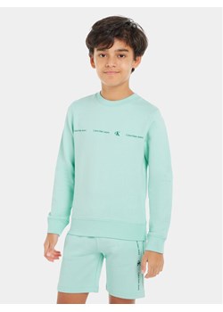 Calvin Klein Jeans Bluza Minimalistic IB0IB02050 Niebieski Regular Fit ze sklepu MODIVO w kategorii Bluzy chłopięce - zdjęcie 182693342