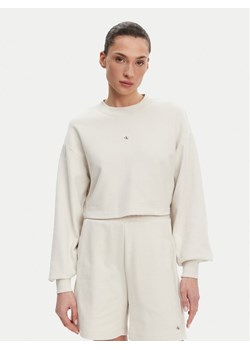 Calvin Klein Jeans Bluza J20J225370 Beżowy Regular Fit ze sklepu MODIVO w kategorii Bluzy damskie - zdjęcie 182693812