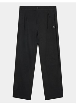 Calvin Klein Jeans Spodnie materiałowe Ceremony IB0IB01936 Czarny Regular Fit ze sklepu MODIVO w kategorii Spodnie chłopięce - zdjęcie 182695151