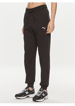 Puma Spodnie dresowe HER 677889 Czarny Relaxed Fit ze sklepu MODIVO w kategorii Spodnie damskie - zdjęcie 182699834