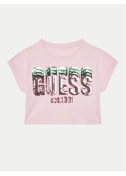 Guess T-Shirt J5RI10 K8HM4 Różowy Regular Fit ze sklepu MODIVO w kategorii Bluzki dziewczęce - zdjęcie 182700984