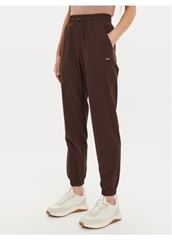 Athlecia Spodnie dresowe Hero W Track EA233336 Brązowy Regular Fit ze sklepu MODIVO w kategorii Spodnie damskie - zdjęcie 182704520