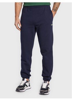 Lacoste Spodnie dresowe XH9610 Granatowy Regular Fit ze sklepu MODIVO w kategorii Spodnie męskie - zdjęcie 182706194