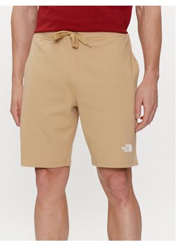 The North Face Szorty sportowe Graphic NF0A3S4F Beżowy Regular Fit ze sklepu MODIVO w kategorii Spodenki męskie - zdjęcie 182706540