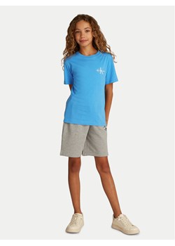 Calvin Klein Jeans T-Shirt IU0IU00678 Niebieski Regular Fit ze sklepu MODIVO w kategorii Bluzki dziewczęce - zdjęcie 182708643