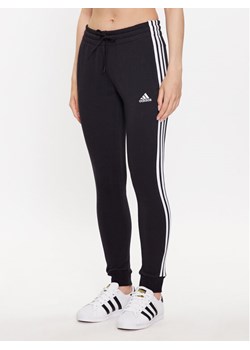 adidas Spodnie dresowe HZ5753 Czarny Slim Fit ze sklepu MODIVO w kategorii Spodnie damskie - zdjęcie 182711334