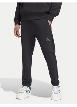 adidas Spodnie dresowe ALL SZN French Terry IV5216 Czarny Loose Fit ze sklepu MODIVO w kategorii Spodnie męskie - zdjęcie 182711544