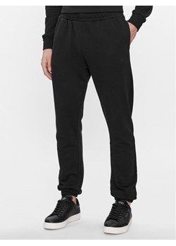 Pepe Jeans Spodnie dresowe Joe Jogger PM211645 Czarny Regular Fit ze sklepu MODIVO w kategorii Spodnie męskie - zdjęcie 182712664