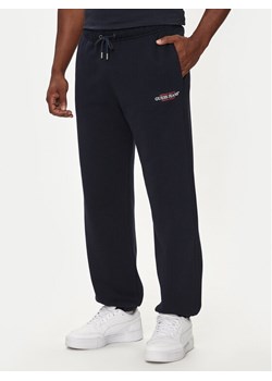 Guess Jeans Spodnie dresowe M4YB18 K9V31 Granatowy Regular Fit ze sklepu MODIVO w kategorii Spodnie męskie - zdjęcie 182718231