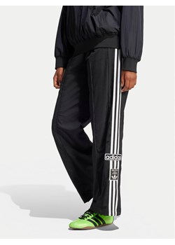 adidas Spodnie dresowe adicolor Adibreak JD0857 Czarny Loose Fit ze sklepu MODIVO w kategorii Spodnie damskie - zdjęcie 182718483