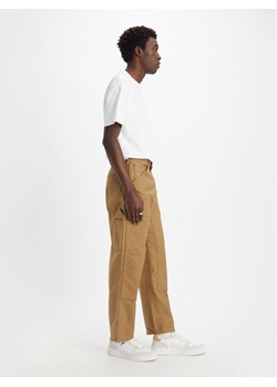 Levi's® Jeansy Workwear 565™ A5756-0001 Beżowy Relaxed Fit ze sklepu MODIVO w kategorii Jeansy męskie - zdjęcie 182720403