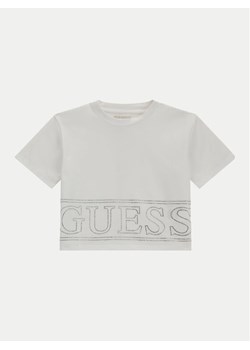 Guess T-Shirt J4YI17 K6YW4 Biały Boxy Fit ze sklepu MODIVO w kategorii Bluzki dziewczęce - zdjęcie 182720450