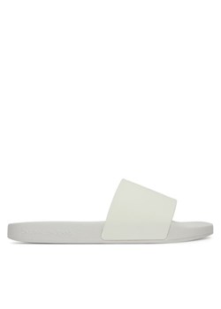 Calvin Klein Jeans Klapki Slide Monogram Tpu YW0YW01715 Biały ze sklepu MODIVO w kategorii Klapki damskie - zdjęcie 182720774