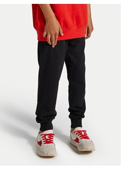 Coccodrillo Spodnie dresowe ZC4120104VBA Czarny Slim Fit ze sklepu MODIVO w kategorii Spodnie chłopięce - zdjęcie 182721153