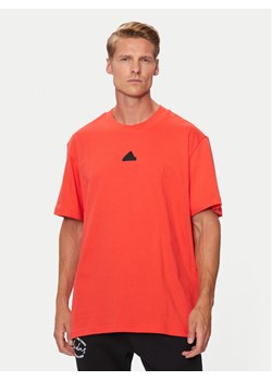 adidas T-Shirt Brand Love IW3540 Pomarańczowy Loose Fit ze sklepu MODIVO w kategorii T-shirty męskie - zdjęcie 182722002