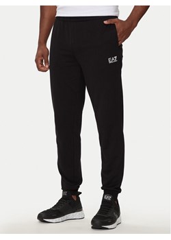 EA7 Emporio Armani Spodnie dresowe 8NPP66 PJVRZ 1200 Czarny Regular Fit ze sklepu MODIVO w kategorii Spodnie męskie - zdjęcie 182723830