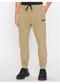 Hugo Spodnie dresowe Drokko 50494571 Brązowy Relaxed Fit ze sklepu MODIVO w kategorii Spodnie męskie - zdjęcie 182724380