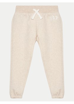 Gap Spodnie dresowe 699662-14 Beżowy Regular Fit ze sklepu MODIVO w kategorii Spodnie chłopięce - zdjęcie 182726602