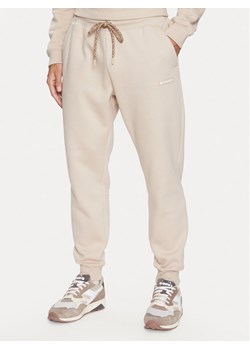 Columbia Spodnie dresowe Marble Canyon™ Heavyweight Fleece Pant Brązowy Regular Fit ze sklepu MODIVO w kategorii Spodnie męskie - zdjęcie 182726820
