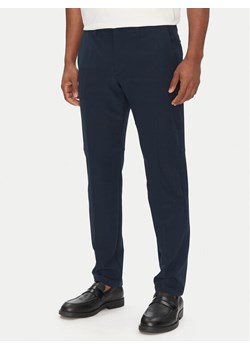 BOSS Spodnie materiałowe T_Commuter-Slim 50534303 Granatowy Slim Fit ze sklepu MODIVO w kategorii Spodnie męskie - zdjęcie 182728314