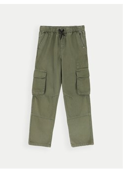 Coccodrillo Spodnie materiałowe ZC4119102GBJ Zielony Regular Fit ze sklepu MODIVO w kategorii Spodnie dziewczęce - zdjęcie 182729214