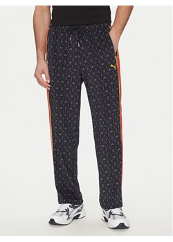 Puma Spodnie dresowe Road To Unity T7 629596 Granatowy Regular Fit ze sklepu MODIVO w kategorii Spodnie męskie - zdjęcie 182729524