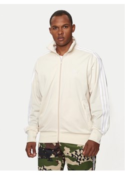 adidas Bluza adicolor Classics Firebird IR9892 Écru Loose Fit ze sklepu MODIVO w kategorii Bluzy męskie - zdjęcie 182729810