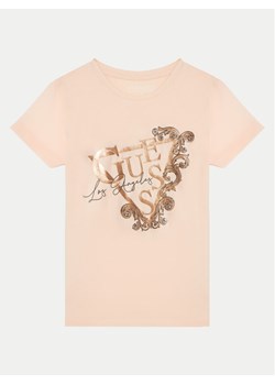 Guess T-Shirt J5RI35 K6YW4 Koralowy Regular Fit ze sklepu MODIVO w kategorii Bluzki dziewczęce - zdjęcie 182729982