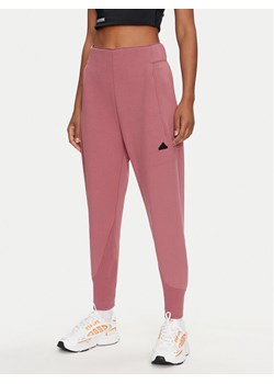 adidas Spodnie dresowe Z.N.E. IW7771 Różowy Regular Fit ze sklepu MODIVO w kategorii Spodnie damskie - zdjęcie 182736530