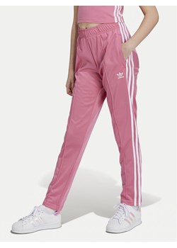 adidas Spodnie dresowe Trefoil IY4032 Różowy Regular Fit ze sklepu MODIVO w kategorii Spodnie dziewczęce - zdjęcie 182737010