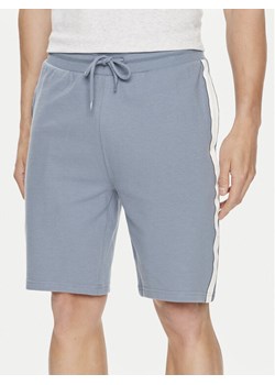 Tommy Hilfiger Szorty sportowe UM0UM03008 Niebieski Regular Fit ze sklepu MODIVO w kategorii Spodenki męskie - zdjęcie 182737464