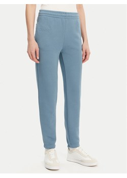 Lacoste Spodnie dresowe XF0353 Niebieski Regular Fit ze sklepu MODIVO w kategorii Spodnie damskie - zdjęcie 182737522