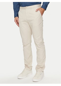 Tommy Hilfiger Chinosy Denton MW0MW25964 Beżowy Straight Fit ze sklepu MODIVO w kategorii Spodnie męskie - zdjęcie 182741680