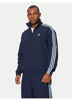 adidas Bluza adicolor Firebird JP1253 Granatowy Loose Fit ze sklepu MODIVO w kategorii Bluzy męskie - zdjęcie 182744133
