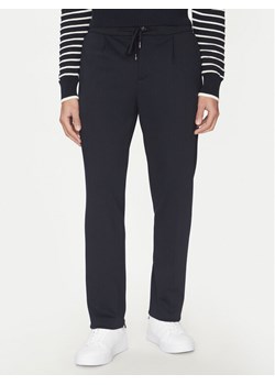 Tommy Hilfiger Spodnie materiałowe Punto MW0MW39197 Granatowy Regular Fit ze sklepu MODIVO w kategorii Spodnie męskie - zdjęcie 182744143