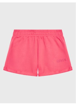 Guess Szorty materiałowe J3GD02 KA6R3 Różowy Regular Fit ze sklepu MODIVO w kategorii Spodenki dziewczęce - zdjęcie 182744224