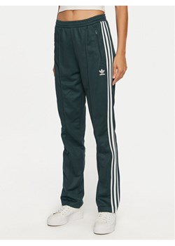 adidas Spodnie dresowe Beckenbauer IY2226 Zielony Regular Fit ze sklepu MODIVO w kategorii Spodnie damskie - zdjęcie 182747961
