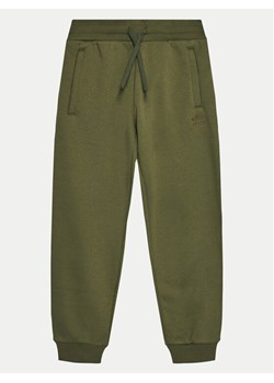 adidas Spodnie dresowe Boyfriend IX7645 Zielony Loose Fit ze sklepu MODIVO w kategorii Spodnie chłopięce - zdjęcie 182749791