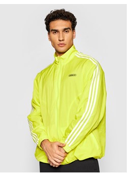 adidas Kurtka przejściowa Reverse Track GN3818 Żółty Regular Fit ze sklepu MODIVO w kategorii Kurtki męskie - zdjęcie 182750973